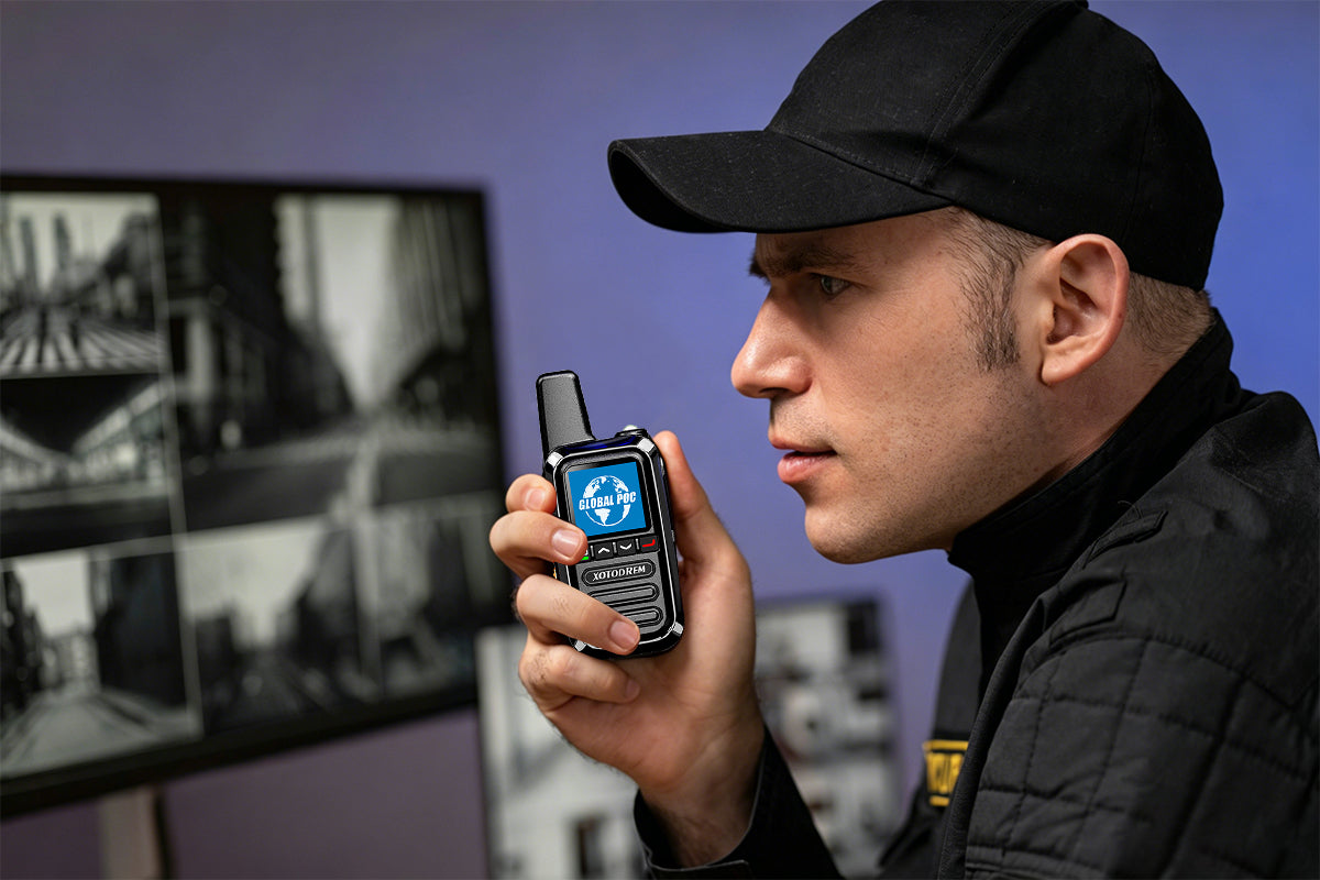 Security guard using XOTODREM 4G LTE PoC walkie talkie for push-to-talk communication in surveillance control room
